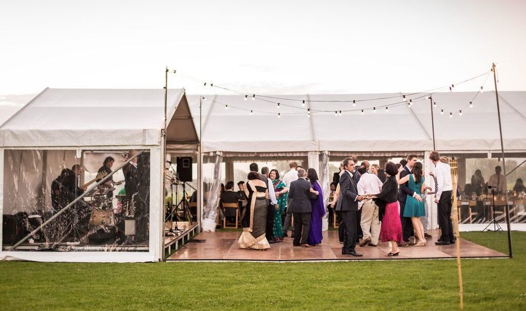 outdoor timber dance floor, festoon lighting, marquee wedding, white roof, clear walls